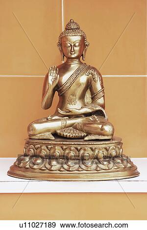 Stock Photo - Close-up of a statue of Buddha. Fotosearch