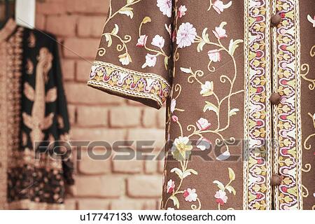 Stock Image - Close-up of clothes in a clothing store. Fotosearch