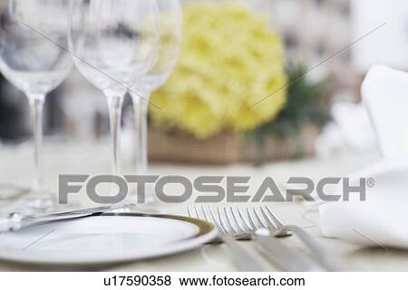 Close-up of cutlery and crockery on the dining table View Large Photo Image Stock Photo - Close-up of cutlery and crockery on the dining table. Fotosearch