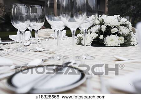 Close-up of cutlery and crockery on the dining table View Large Photo Image Stock Photograph - Close-up of cutlery and crockery on the dining table. Fotosearch