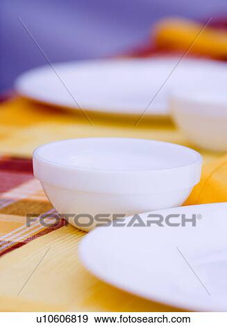 Stock Photo - Close-up of plates and bowls on the table. Fotosearch