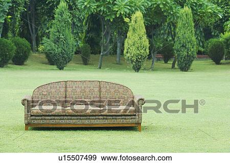 Stock Photo - Couch on a lawn. Fotosearch