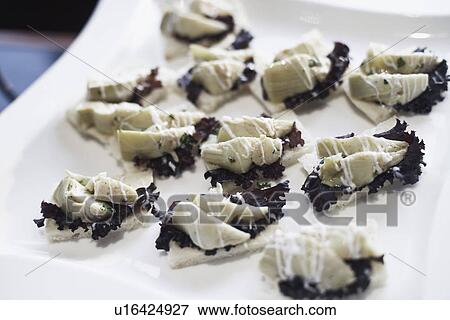 High angle view of appetizers on a tray View Large Photo Image Stock Photo - High angle view of appetizers on a tray. Fotosearch