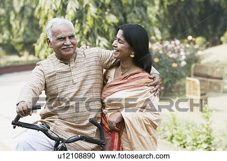 Close-up of a mature couple smiling View Large Photo Image Stock Image - Close-up of a mature couple smiling. Fotosearch