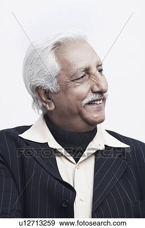 Close-up of a senior man looking sideways View Large Photo Image Stock Photo - Close-up of a senior man looking sideways. Fotosearch