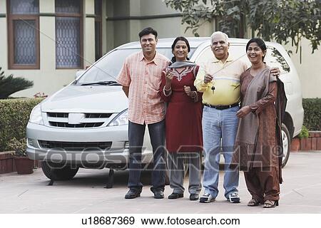 Stock Photo - Portrait of a mature couple and their two children. Fotosearch