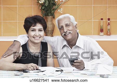 Stock Image - Portrait of a mature couple smiling. Fotosearch