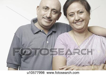 Portrait of a mature couple smiling View Large Photo Image Stock Photo - Portrait of a mature couple smiling. Fotosearch