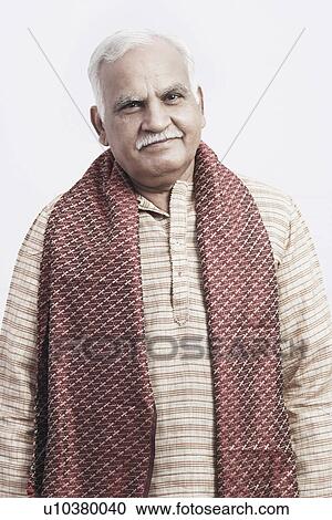 Stock Image - Portrait of a mature man wearing traditional clothing. Fotosearch