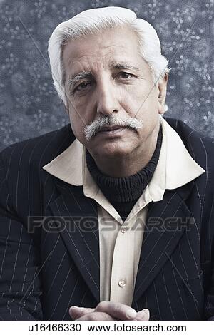 Portrait of a senior man with his hands clasped View Large Photo Image Stock Image - Portrait of a senior man with his hands clasped. Fotosearch