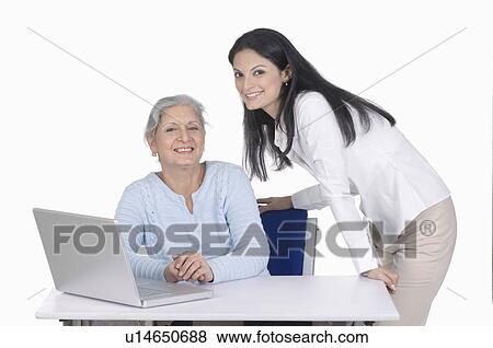 Portrait of a two businesswomen smiling View Large Photo Image Stock Photo - Portrait of a two businesswomen smiling. Fotosearch
