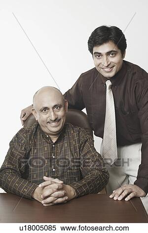 Portrait of two businessmen smiling View Large Photo Image Stock Photography - Portrait of two businessmen smiling. Fotosearch