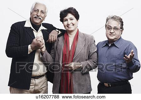 Portrait of two mature men and a mature woman smiling View Large Photo Image Stock Photo - Portrait of two mature men and a mature woman smiling. Fotosearch