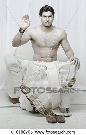 Stock Photography - Portrait of a young man gesturing. Fotosearch
