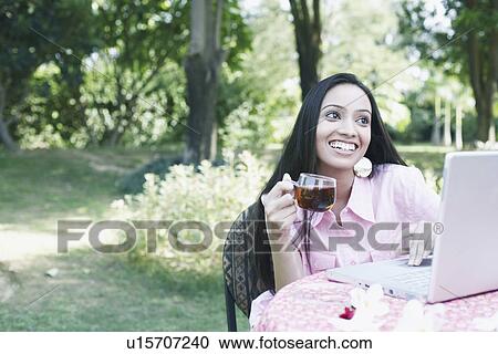 Teenage girl holding a cup of tea View Large Photo Image Stock Image - Teenage girl holding a cup of tea. Fotosearch