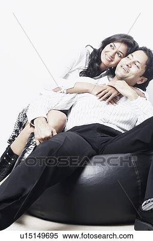 Stock Photography - Young woman leaning on a young man. Fotosearch