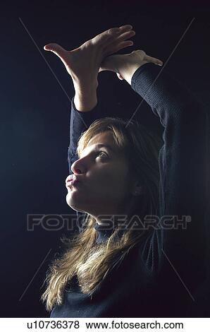 Stock Photo - People, Attitudes, Young Attitudes, Woman, Face, Blond, Blond hair. Fotosearch