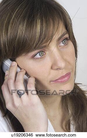 Stock Photograph - People, Attitudes, Young Attitudes, Woman, Face, Blond, Blond hair. Fotosearch