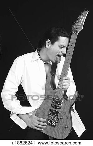 Stock Image - People, Attitudes, Young Attitudes, Young man, Brown, Brown hair. Fotosearch