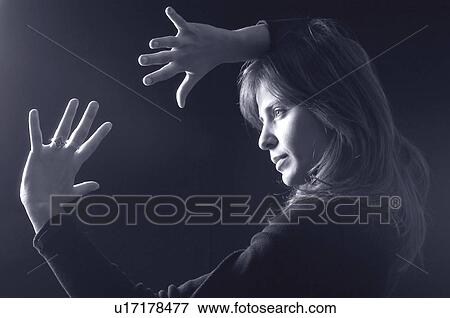 Stock Photo - People, Attitudes, Young Attitudes, Woman, Young woman, Pose, Posing. Fotosearch