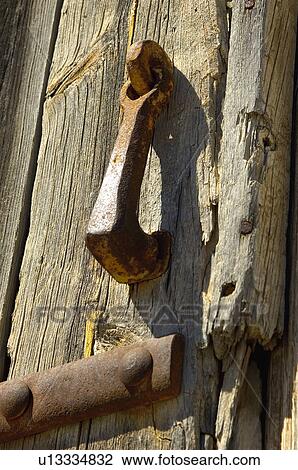 Stock Image - Spain, Spanish, Building, Door, Wood, Wooden door, Doorknocker. Fotosearch