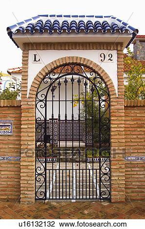 Stock Image - Spain, Spanish, Building, House, Entrance, Door, Grate. Fotosearch