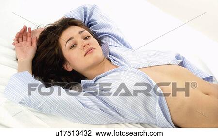 Stock Image - Woman, Beauty, Young, Young woman, Brown hair, Bed, Morning. Fotosearch