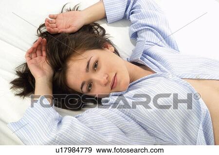 Woman, Beauty, Young, Young woman, Brown hair, Bed, Morning View Large Photo Image Stock Photo - Woman, Beauty, Young, Young woman, Brown hair, Bed, Morning. Fotosearch