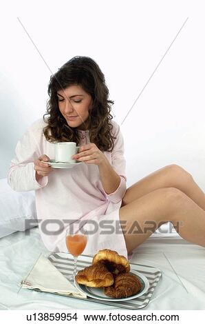 Woman, Breakfast, Having breakfast, Beauty, Young, Young woman, Brown hair View Large Photo Image Picture - Woman, Breakfast, Having breakfast, Beauty, Young, Young woman, Brown hair. Fotosearch