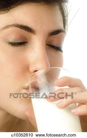 Stock Image - Woman, Breakfast, Having breakfast, Beauty, Young, Young woman, Brown hair. Fotosearch