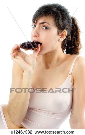 Stock Image - Woman, Breakfast, Having breakfast, Beauty, Young, Young woman, Brown hair. Fotosearch