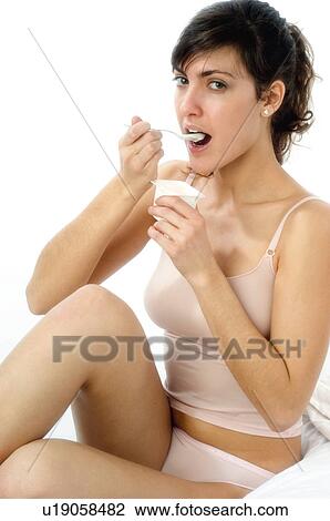 Stock Image - Woman, Breakfast, Having breakfast, Beauty, Young, Young woman, Morning. Fotosearch