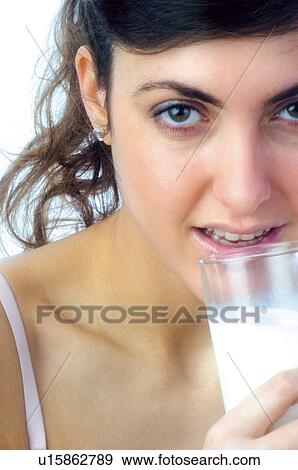 Stock Photo - Woman, Breakfast, Having breakfast, Beauty, Young, Young woman, Brown hair. Fotosearch