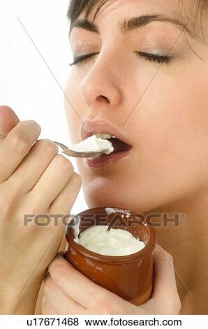 Stock Photo - Woman, Breakfast, Having breakfast, Beauty, Young, Young woman, Morning. Fotosearch