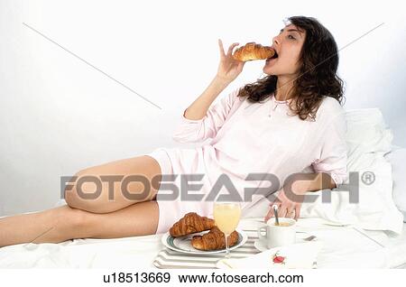 Woman, Breakfast, Having breakfast, Beauty, Young, Young woman, Brown hair View Large Photo Image Stock Photo - Woman, Breakfast, Having breakfast, Beauty, Young, Young woman, Brown hair. Fotosearch
