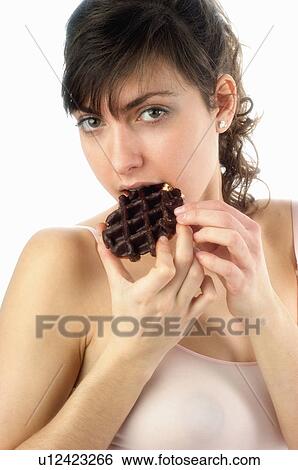 Stock Photograph - Woman, Breakfast, Having breakfast, Beauty, Young, Young woman, Brown hair. Fotosearch