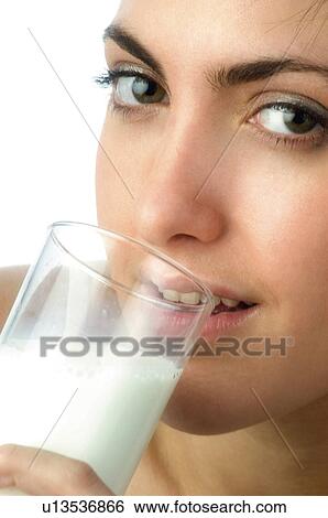 Stock Photograph - Woman, Breakfast, Having breakfast, Beauty, Young, Young woman, Brown hair. Fotosearch