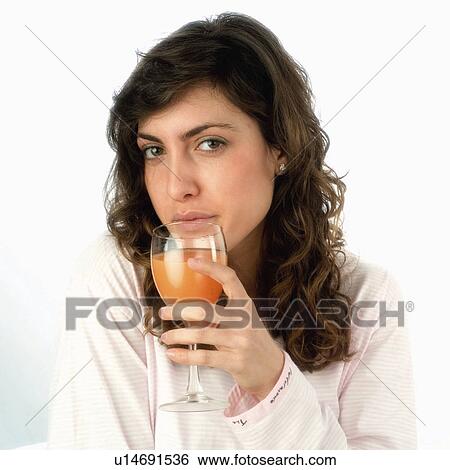 Stock Photograph - Woman, Breakfast, Having breakfast, Beauty, Young, Young woman, Brown hair. Fotosearch