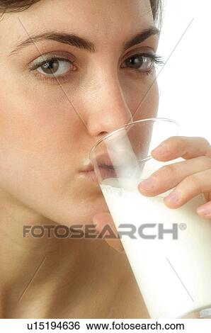 Stock Photograph - Woman, Breakfast, Having breakfast, Beauty, Young, Young woman, Brown hair. Fotosearch