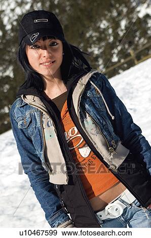 Stock Photo - Woman, Young, Young woman, Beautiful, Winter, Snow, Clothes. Fotosearch