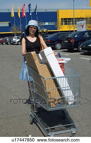 Stock Image - Woman, Young, Young woman, Beautiful, Consumer, Shop, Shopping. Fotosearch