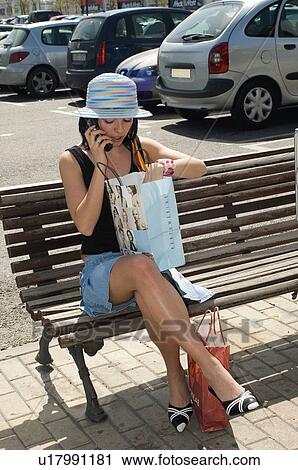 Stock Image - Woman, Young, Young woman, Beautiful, Consumer, Shop, Shopping. Fotosearch