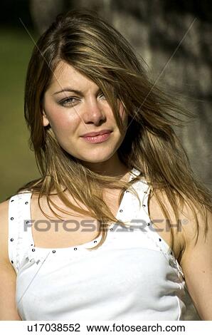 Stock Image - Woman, Young, Blond, Blonde, Blond hair, Long hair, T shirt. Fotosearch