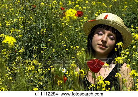 Picture - Woman, Young, Nature, Country, Flowers, Country of flowers, Yellow. Fotosearch