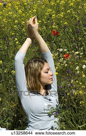Woman, Young, Nature, Country, Flowers, Country of flowers, Yellow View Large Photo Image Picture - Woman, Young, Nature, Country, Flowers, Country of flowers, Yellow. Fotosearch