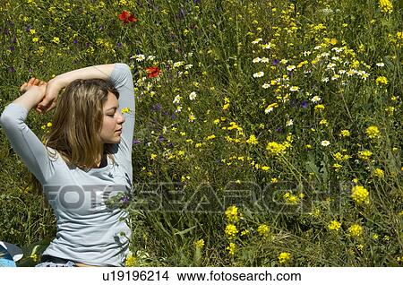 Picture - Woman, Young, Nature, Country, Flowers, Country of flowers, Yellow. Fotosearch