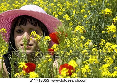 Stock Image - Woman, Young, Nature, Country, Flowers, Country of flowers, Yellow. Fotosearch