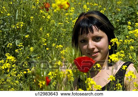 Stock Image - Woman, Young, Nature, Country, Flowers, Country of flowers, Yellow. Fotosearch