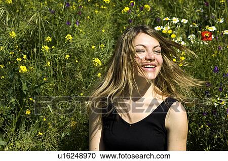 Stock Image - Woman, Young, Nature, Country, Flowers, Country of flowers, Yellow. Fotosearch