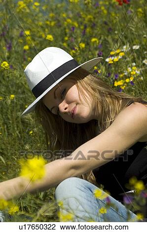 Stock Image - Woman, Young, Nature, Country, Flowers, Country of flowers, Yellow. Fotosearch
